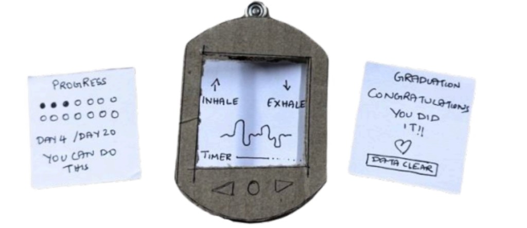 Cardboard mid-fidelity Calma prototype with inhale/exhale screen mockup, progress tracker, and graduation screen